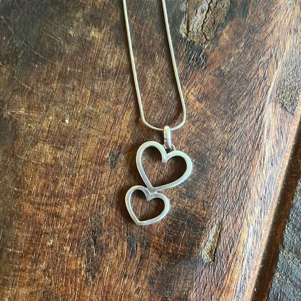 Sterling silver necklace with a charm